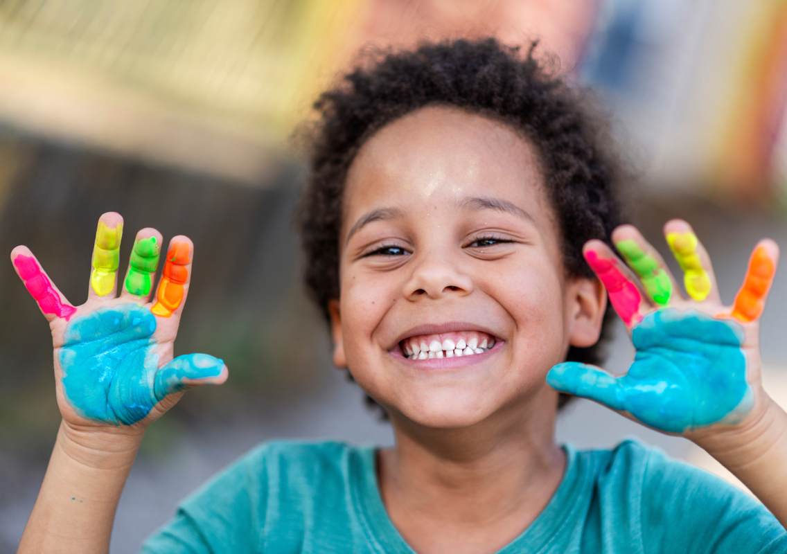 boy with paint on his hands