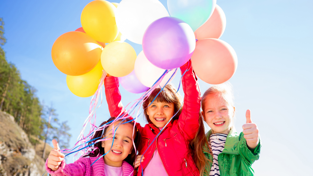 Kids holding balloons